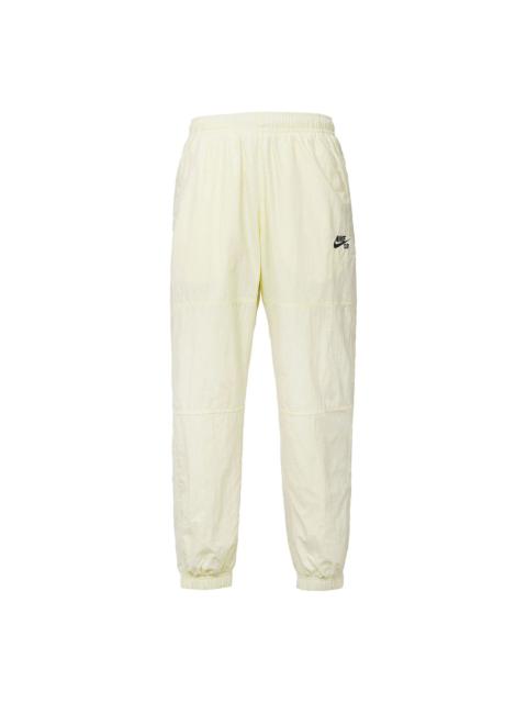 Nike Men's Nike Logo Pattern Loose Bundle Feet Sports Pants/Trousers/Joggers Beige CW7716-113