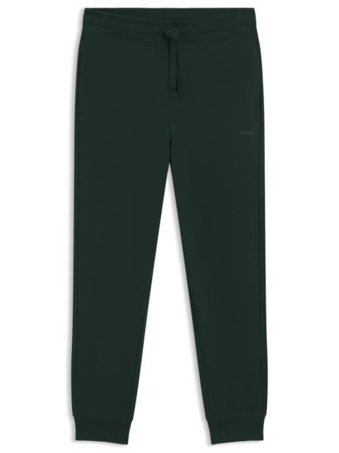 HUGO CUFFED SWEATPANTS IN COTTON TERRY WITH LOGO PRINT