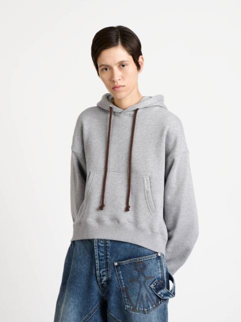 JW Anderson WOMENS CURVED HEM HOODIE IN MID GREY MELANGE