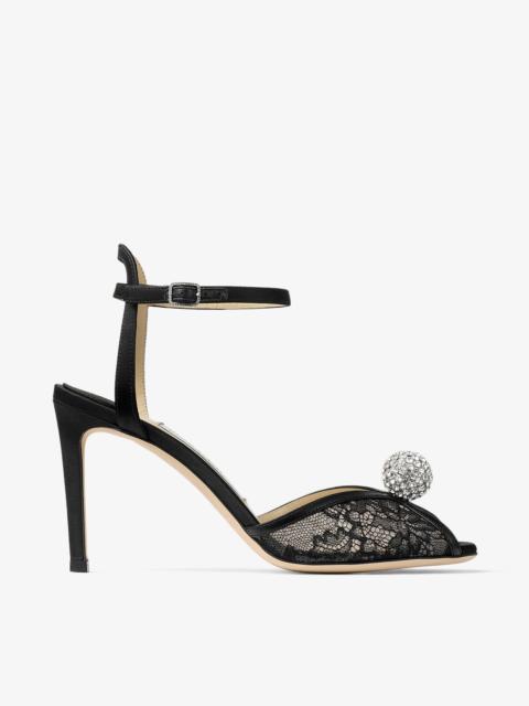 JIMMY CHOO Sacora 85
Black Lace Sandals with Crystal-Embellished Sphere