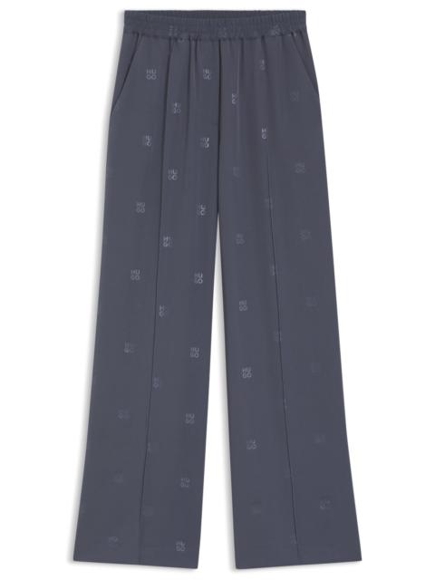 HUGO RELAXED-FIT TROUSERS WITH STACKED LOGOS