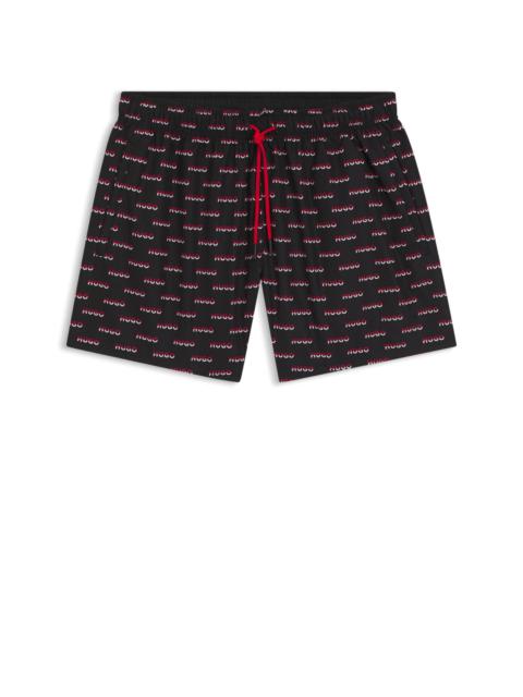 HUGO SWIM SHORTS WITH ALL-OVER SPLIT-LOGO PRINT