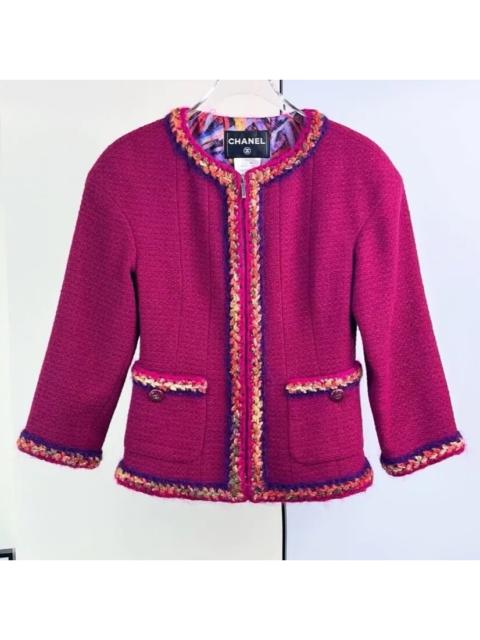 CHANEL Chanel purple-red jacket with contrasting trim and a fitted waist.
