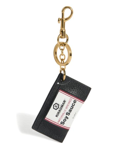 Anya Hindmarch Anya Hindmarch ANYA BRANDS CHARM KIKKOMAN IN BLACK SHINY CAPRA