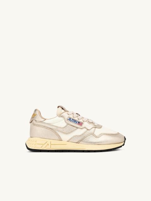 AUTRY REELWIND LOW SNEAKERS IN WHITE NYLON AND GOLD TONE METALIZED LEATHER