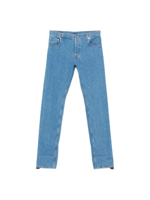 GUCCI logo-patch jeans