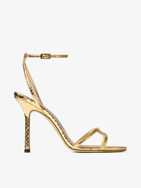 JIMMY CHOO Leo 100
Gold Candy Wrap Leather Sandal