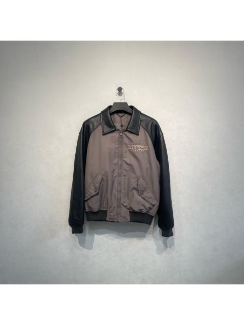 Louis Vuitton Louis Vuitton gray baseball jacket with embossed logo and leather paneling.