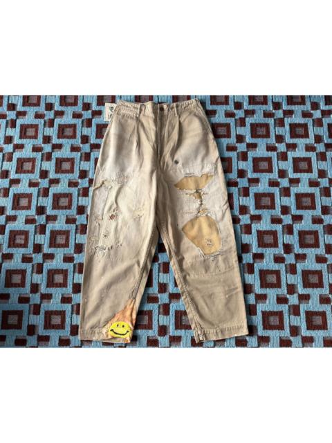 Kapital Kapital's early smiling face destroyed patch pants