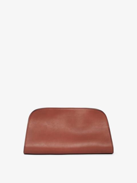 The Row Peggy brown leather clutch