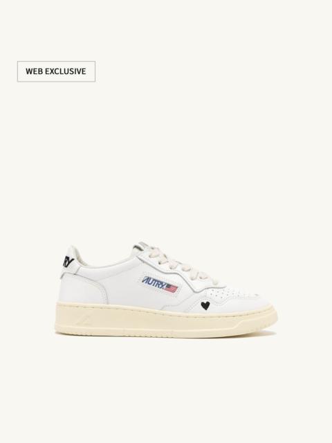 AUTRY MEDALIST 'LOVE' SNEAKERS IN BLACK AND WHITE LEATHER