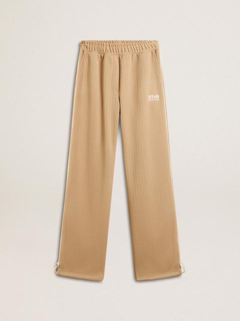 Women’s light beige joggers with white logo