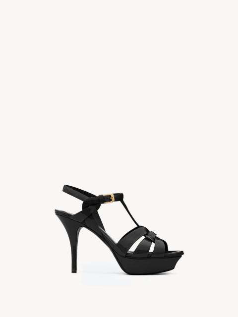 SAINT LAURENT TRIBUTE PLATFORM SANDALS IN PATENT LEATHER