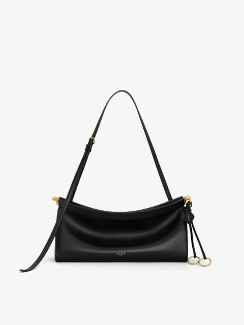 Alaïa LE CLICK EAST WEST MEDIUM BAG IN LEATHER