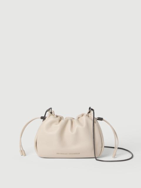 Brunello Cucinelli Mellow mini bucket bag in soft leather with precious chain