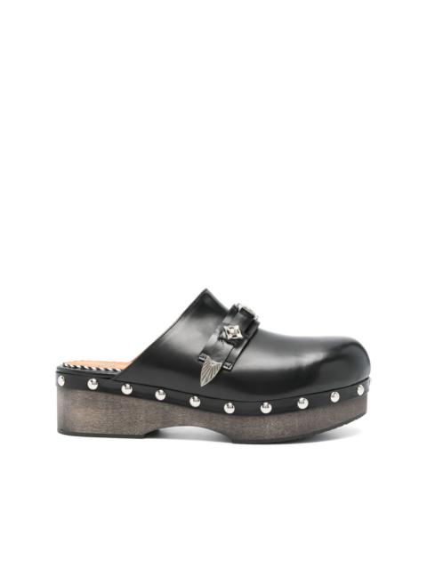 strap-detail clogs