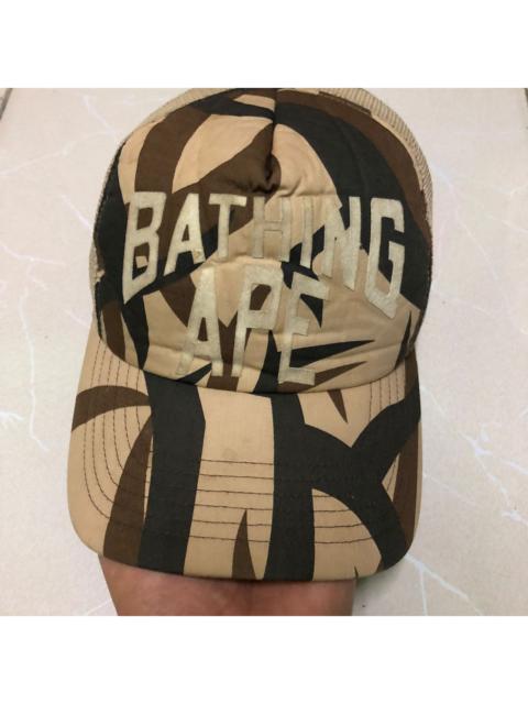 A BATHING APE® 2005 Bape Camo Bathing Ape Spell-Out Trucker Hat