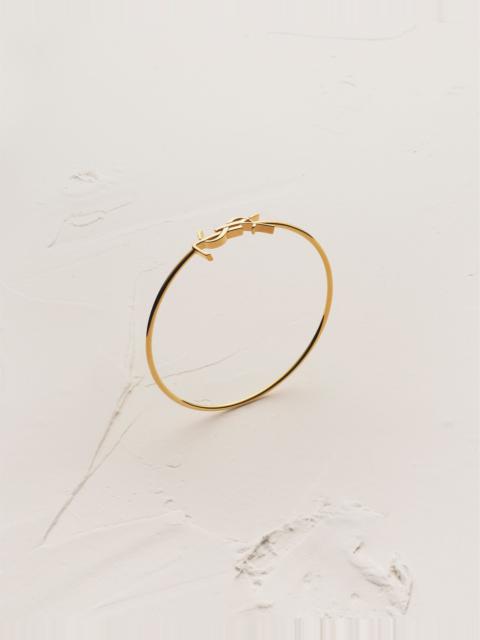 SAINT LAURENT CASSANDRE BANGLE IN 18K YELLOW GOLD