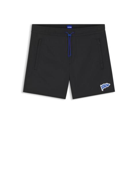 HUGO WATER-REPELLENT SHORTS WITH FLAG LOGO