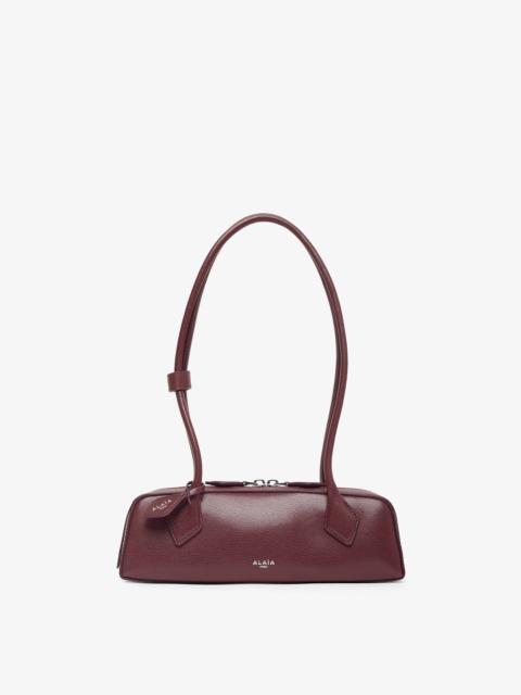 Alaïa Le Teckel Small dark red leather bag