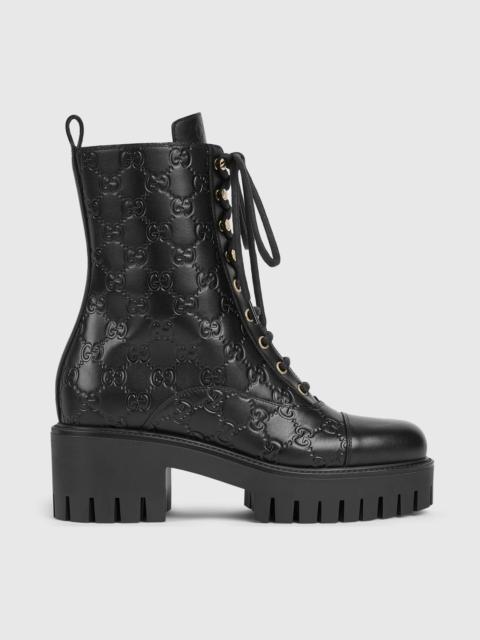 GUCCI Gucci GG Embossed Lace Up Boots