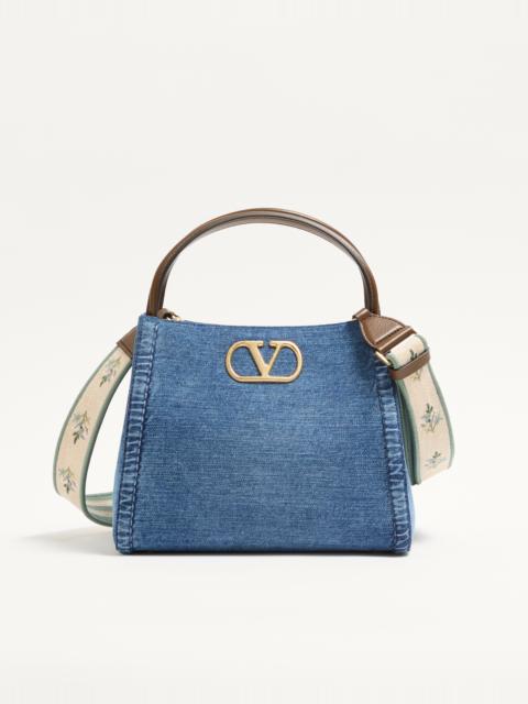 Valentino VALENTINO GARAVANI ALLTIME MEDIUM HANDBAG IN DENIM WITH EMBROIDERED STRAP