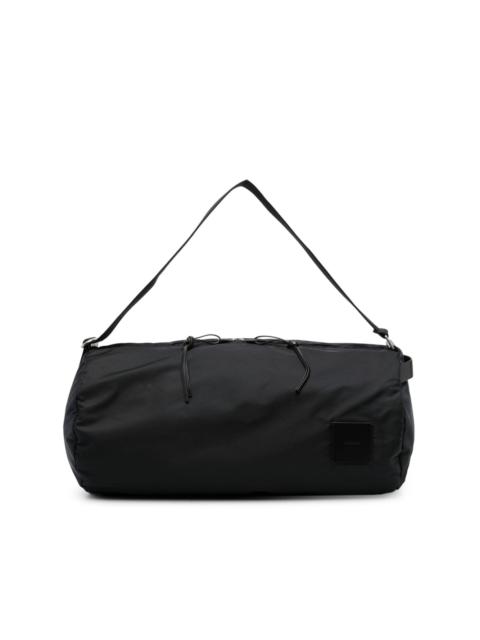Jil Sander logo-patch circular duffle bag