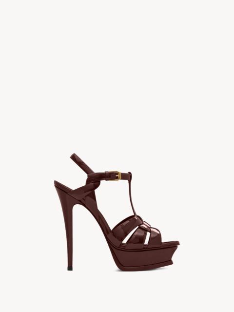 SAINT LAURENT TRIBUTE PLATFORM SANDALS IN PATENT LEATHER