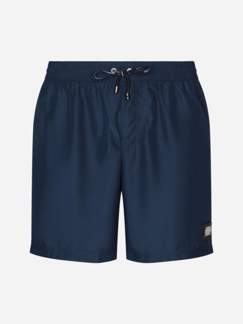 Dolce & Gabbana Long-leg swim trunks with branded tag