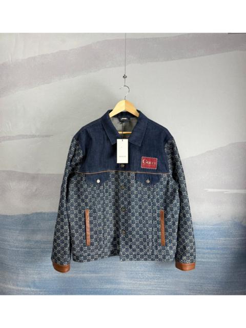 GUCCI Gucci dark blue denim jacket with all-over logo print