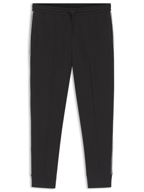 BOSS PIPING-DETAIL TRACKSUIT BOTTOMS IN A COTTON BLEND