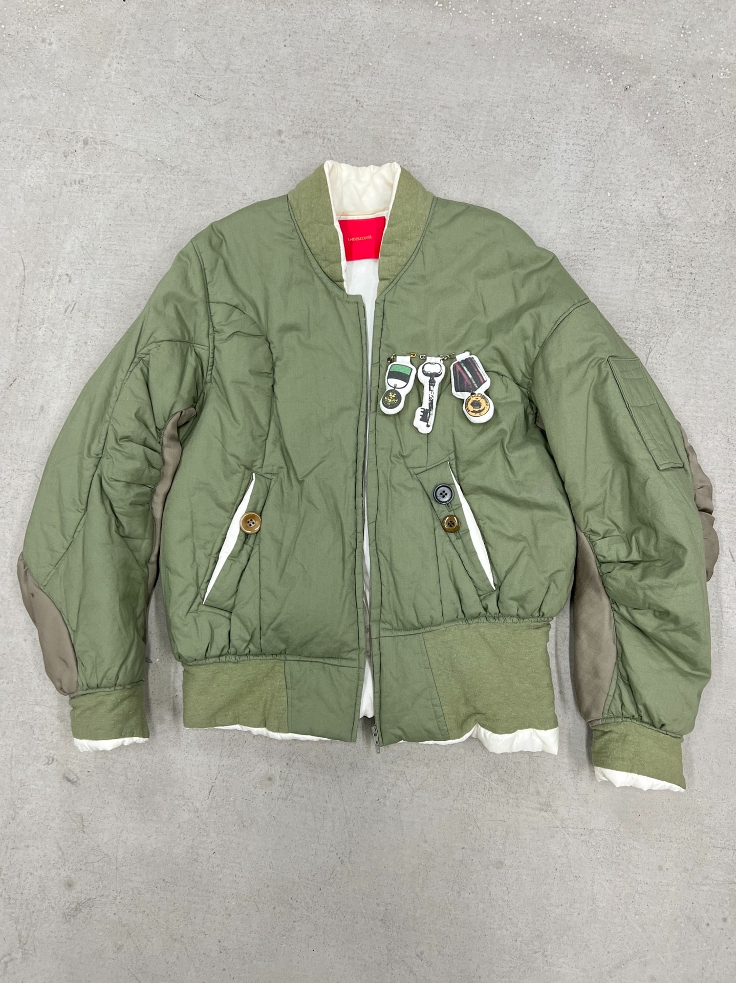 Other Designers Undercover but beautiful Archive badge twisted