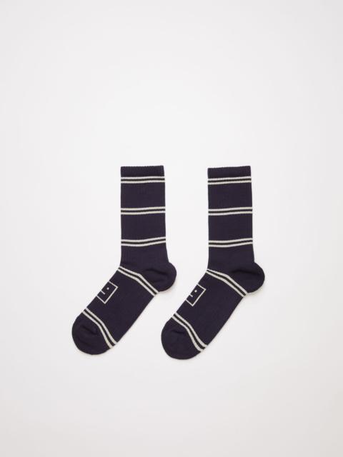 Acne Studios Face jacquard striped socks navy/cream