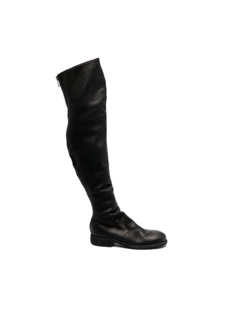 thigh-lenth leather boots