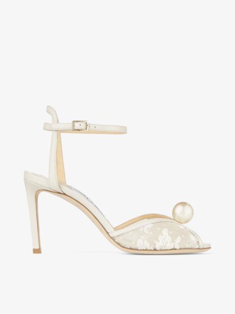 JIMMY CHOO Sacora 85
Ivory Floral Lace Sandals with Pearl Detail