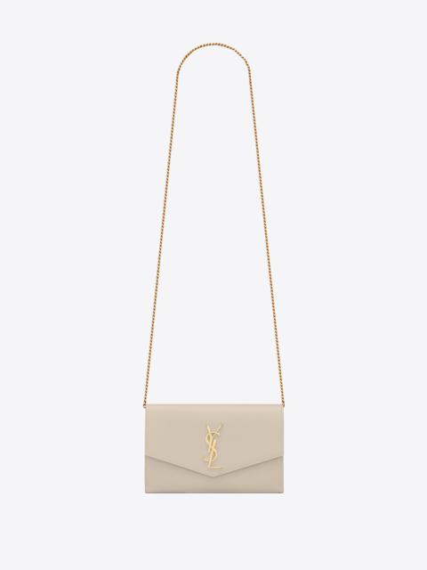 SAINT LAURENT uptown chain wallet in grain de poudre embossed leather