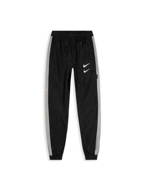 Nike 남자 회색 CJ4877-010를 위한 나이키 운동복 Swoosh 길쌈된 바지