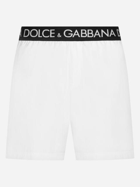 Mid-length swim trunks with branded stretch waistband