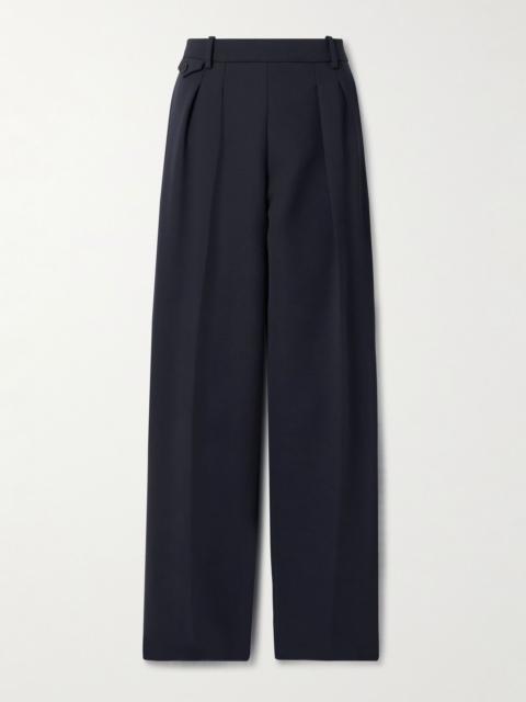 KHAITE Dugan pleated crepe tapered pants Navy