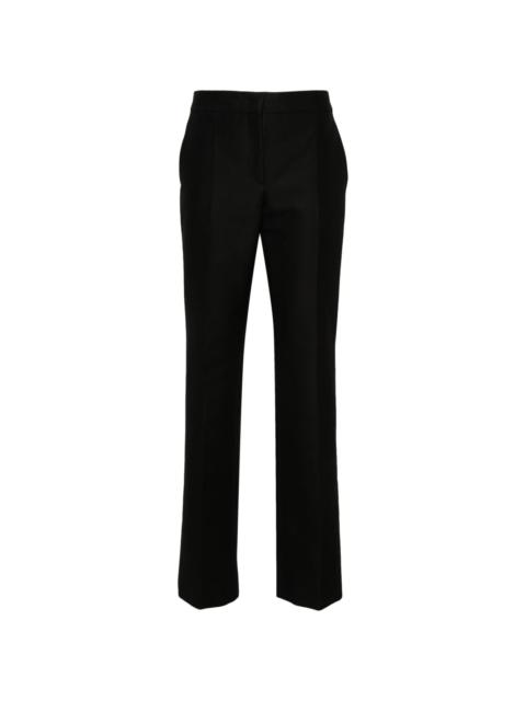 Moschino patch-detail trousers