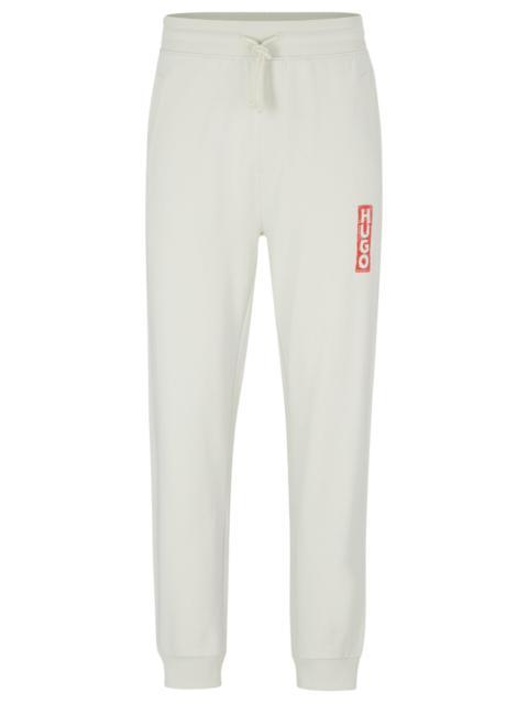 HUGO COTTON-TERRY TRACKSUIT BOTTOMS WITH VERTICAL LOGO