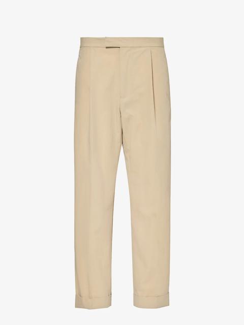 Pleated tapered-leg cotton-blend trousers