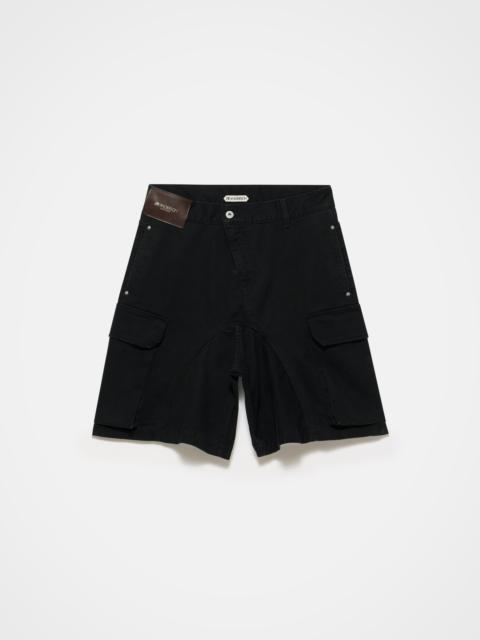 JW Anderson MENS TWISTED PATCH POCKET SHORTS IN BLACK