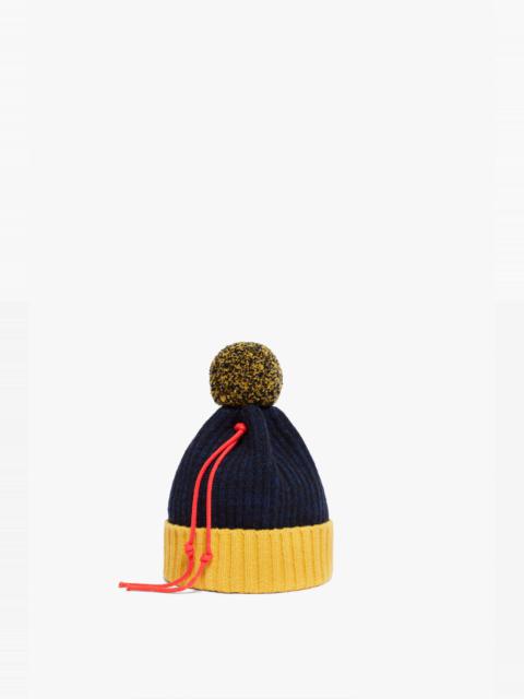 Victoria Beckham Pom Pom Hat in Navy & Yellow