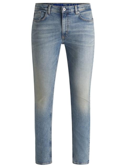 HUGO EXTRA-SLIM-FIT JEANS IN STONEWASHED BLUE STRETCH DENIM