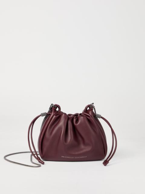 Brunello Cucinelli Mellow mini bucket bag in soft leather with precious chain