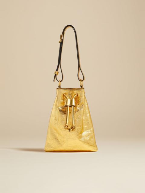 KHAITE The Small Greta Bag in Gold Metallic Leather