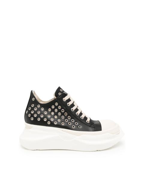 Abstract eyelet-embellished leather sneakers