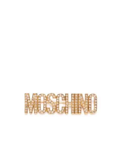 Moschino crystal-embellished logo brooch
