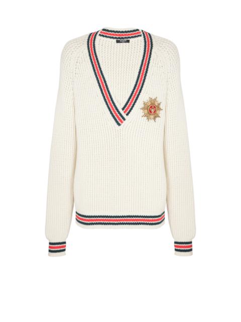 Knit jumper with insignia